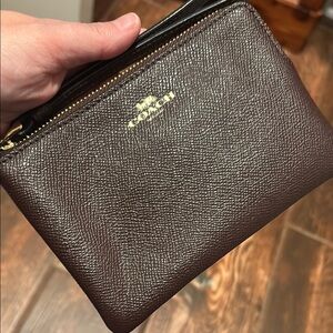Coach dark ox blood Leather wristlet with Gold Accents